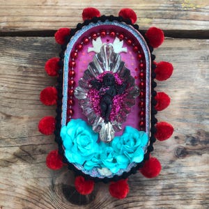 Cherub wallhanging art.
