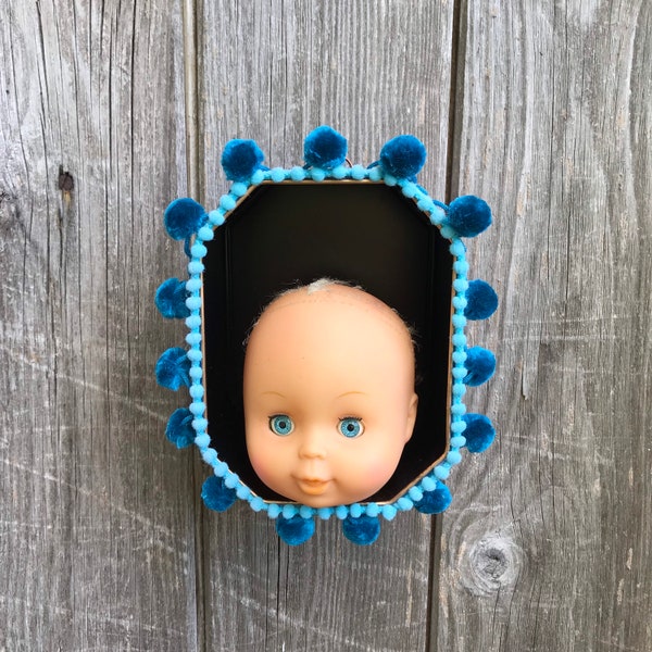 Creepy dolls head in a wallhanging tin nicho. Grotesque art. Assemblage art. Creepy gift.