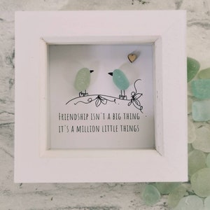 greeny blue sea glass birds in a white box frame