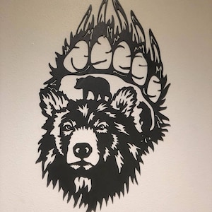 huella de pata de oso de metal