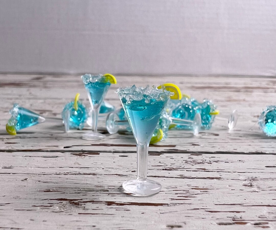 Miniature Martini Glasses Filled Drink With Salted Rim and Fruit Slice ...
