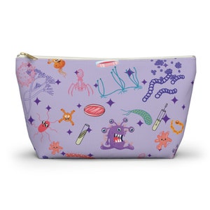 May include: A purple zippered pouch with a whimsical pattern of various microbes, including bacteria, viruses, and fungi. The pouch is perfect for carrying small items like makeup, toiletries, or other essentials.