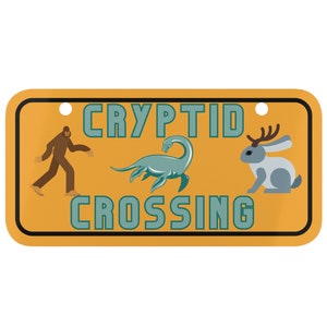 Cryptid Crossing Tiny License Plate | Wall Decor, Bigfoot, Loch Ness Monster, Jackalope, Warning Sign, Urban Legends, Cryptozoology
