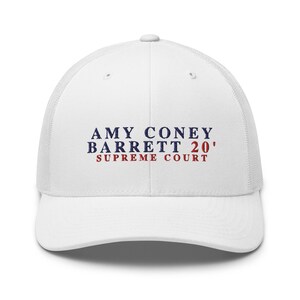 May include: White mesh trucker hat with a blue and red embroidered logo that reads "AMY CONEY BARRETT 20' SUPREME COURT".