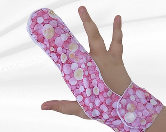 Finger guard. Fabric finger glove to help stop sucking habits. May be pulled off by babies & toddlers.