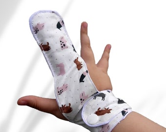 Finger guard. fabric aid to deter finger sucking. Reduce overbite risk. Oral care. Pig theme. May be pulled off by babies & toddlers.