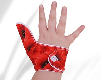Thumb guard in poppy themed fabric. Memorial Day. Deter thumb sucking habits. Not restraints. Babies and toddlers may pull this guard off.