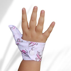 Thumb guard in a ballet slipper themed fabric to help children stop thumb sucking.Not recommended  for babies and young toddlers