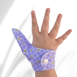 Thumb sucking blocker, fabric barrier glove to help stop long term reflexive sucking habits. May be pulled off by babies & toddlers