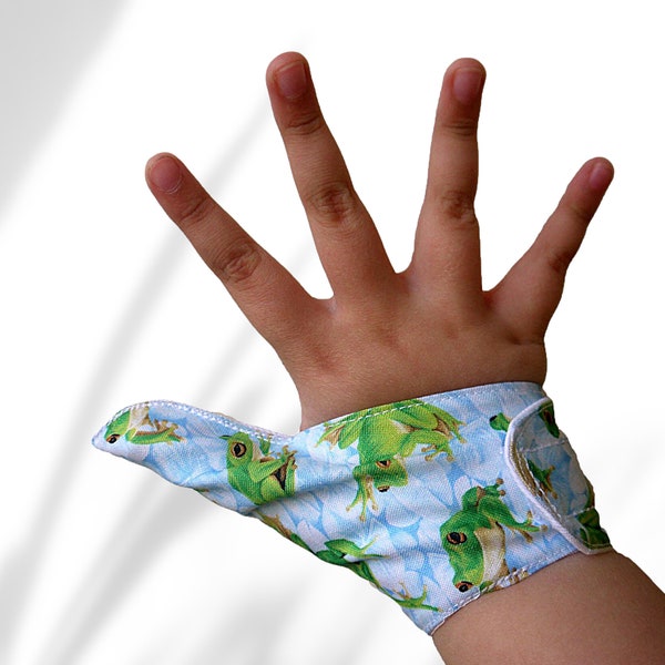 Fabric Thumb guard. A  thumb glove to stop thumb sucking. Made using frog themed fabric. May be pulled off by babies & toddlers.