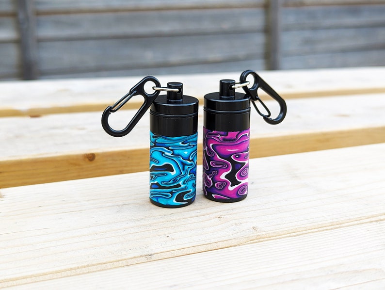 Stash Box, Psychedelic Portable Earplug Container with Necklace or Clip. Black Carabiner Clip