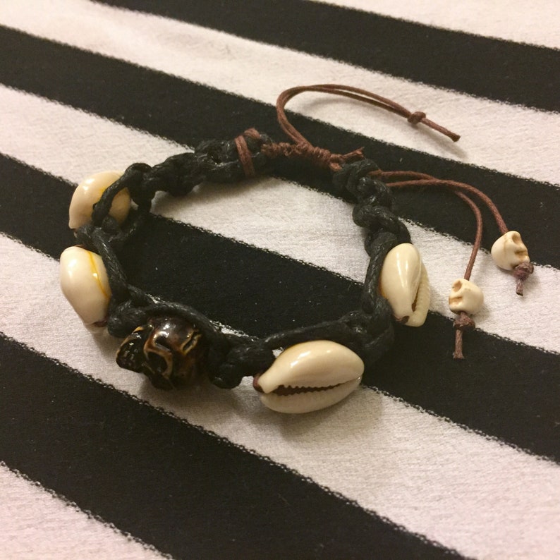 Bracelet with Brown and Black Cord Resin Skull Macrame Detailing Ocean Hawaiian Beach Surfer Punk Rock Music Fashion Scene Cowrie Shells