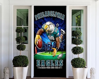 May include: A black door banner with the Philadelphia Eagles logo and a cartoon eagle holding a football. The banner reads "PHILADELPHIA EAGLES" and "EAGLES PRIDE SINCE 1933" in white and green lettering. The background depicts a stadium.