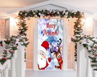 May include: A Christmas-themed door cover featuring Santa Claus and a reindeer with the text "Merry Christmas!" against a blue and white bokeh background. The door is framed by a white structure decorated with festive greenery, ornaments, and snow.