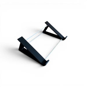 May include: A black metal stand with a rectangular frame and angled supports. Two silver rods connect the supports, creating a minimalist design. The stand is designed to hold a tablet or other device.