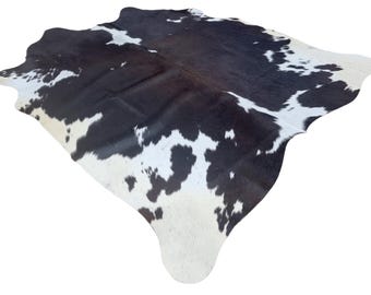 Medium Sized dark brown and white Genuine Cowhide Rug, Hair on Hide, Sold as Seen