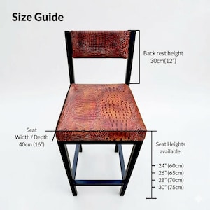 May include: A black-framed chair with a seat and backrest featuring a reddish-brown, textured pattern. The back rest height is 12 inches (30cm), and the seat width/depth is 16 inches (40cm). Seat heights available: 24", 26", 28", and 30". The text "Size Guide" is at the top.