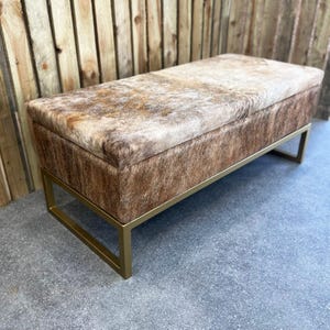 Premium handmade cowhide & steel storage ottoman bench with hinged lid - (b)