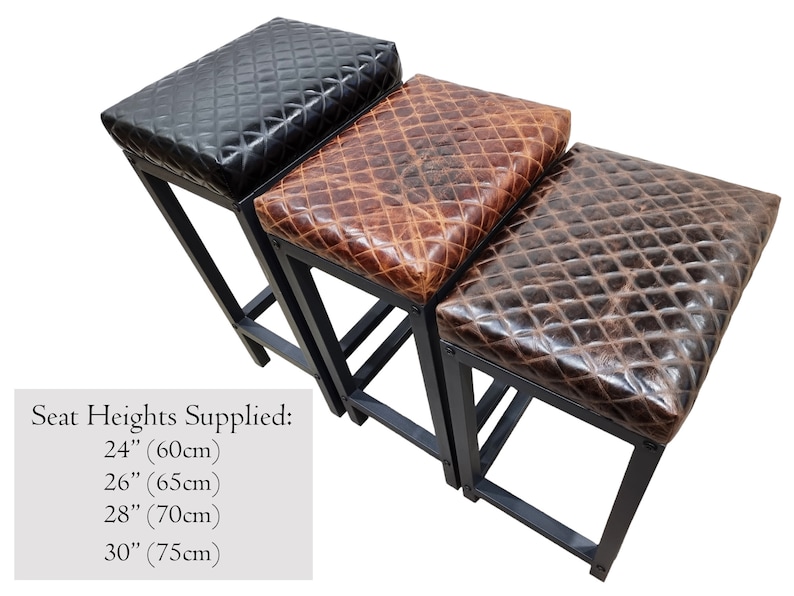 May include: Three bar stools with black metal frames and different colored leather seats. The seats are quilted and have a distressed look. The seat heights are 24 inches (60 cm), 26 inches (65 cm), 28 inches (70 cm), and 30 inches (75 cm).