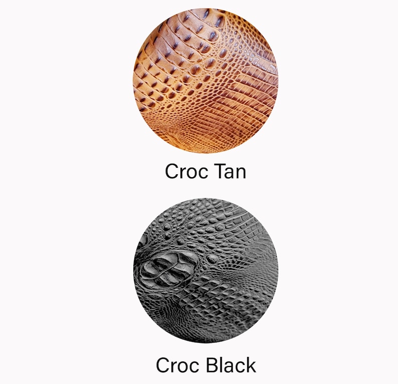 May include: Two circular samples of crocodile-textured leather. One is tan with a warm, brown hue, and the other is black. The text "Croc Tan" and "Croc Black" are below each sample, respectively. The samples are on a white background.