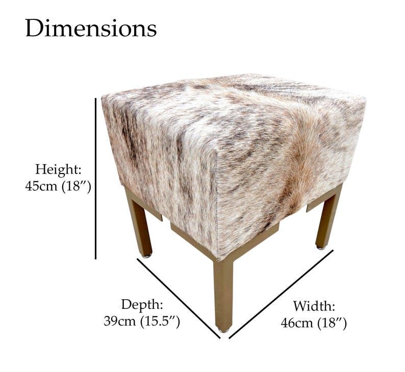 May include: A square ottoman with a cowhide pattern in shades of brown, tan, and white. The ottoman has gold-colored metal legs. Dimensions: 18" wide, 15.5" deep, and 18" high.