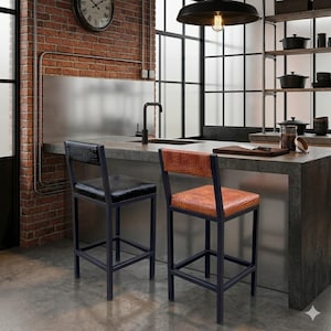 May include: Two black metal bar stools with textured seat and backrests. One stool has a black seat and back, the other has a brown seat and back. The stools are in a kitchen setting with a brick wall and stainless steel accents.
