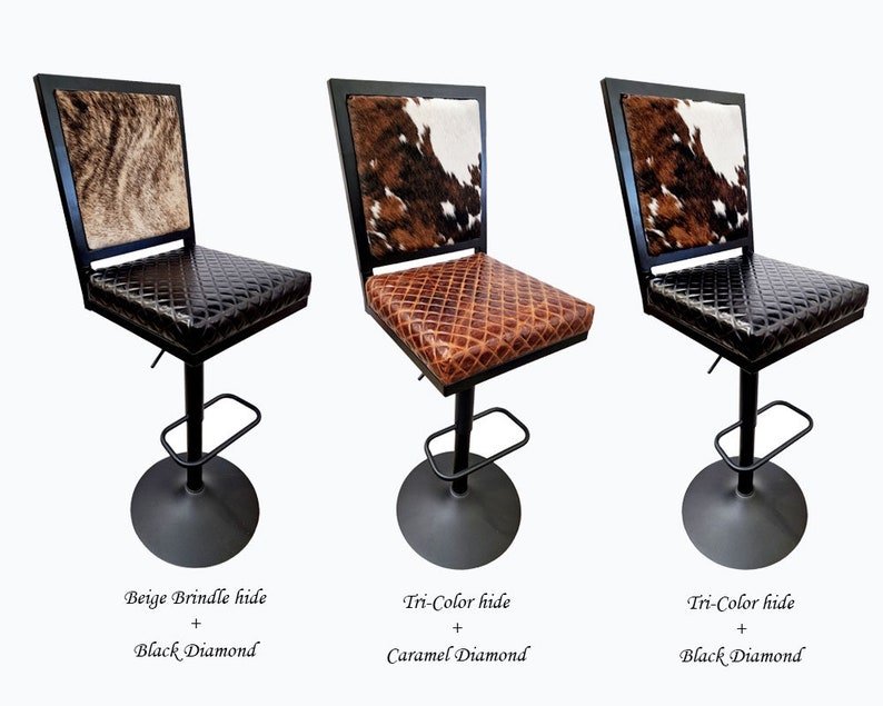 May include: Three bar stools with black metal frames and upholstered seats. The seats are covered in a variety of cowhide patterns, including beige brindle, tri-color, and caramel diamond.
