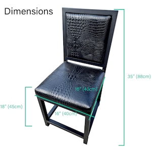 May include: Black bar stool with a crocodile-embossed leather seat and back. The stool measures 18 inches wide, 16 inches deep, and 35 inches high.