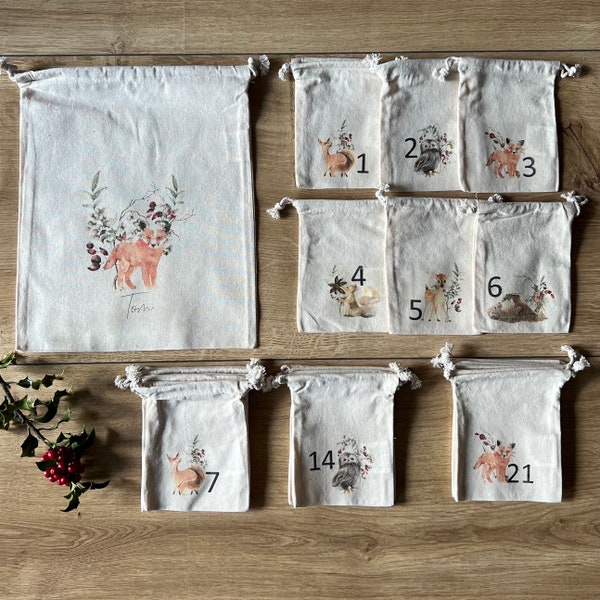 Weihnachtskalender aus 24 Säckchen mit Wintermotiv zum selbst befüllen inkl. personalisierbaren Geschenkbeutel, Adventskalender