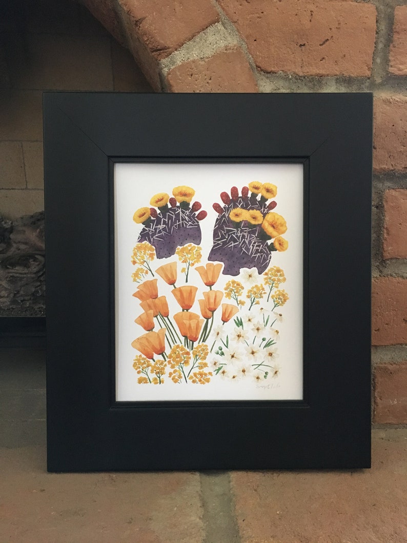 May include: A framed print of a botanical illustration featuring a cluster of orange and yellow flowers, including prickly pear cactus blossoms, against a white background.