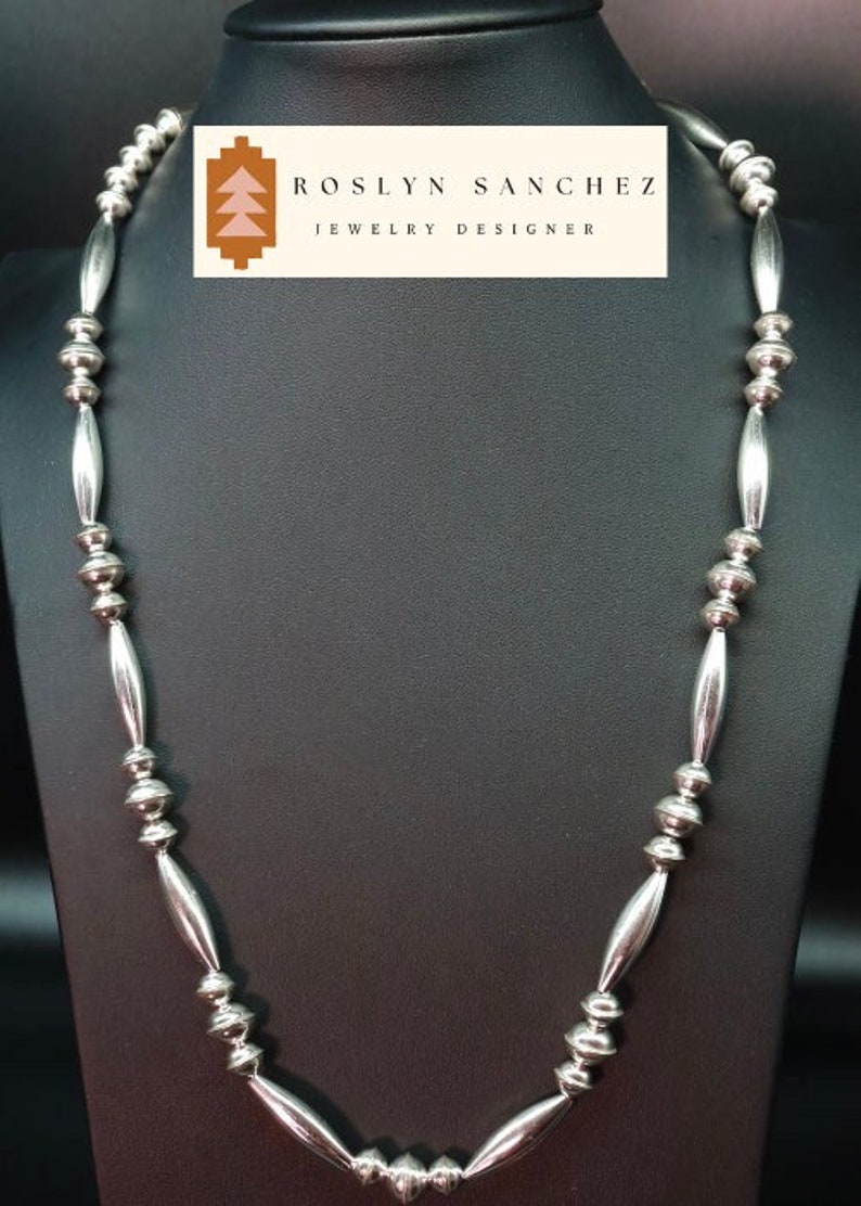 Large high shine sterling silver beaded navajo necklace.
