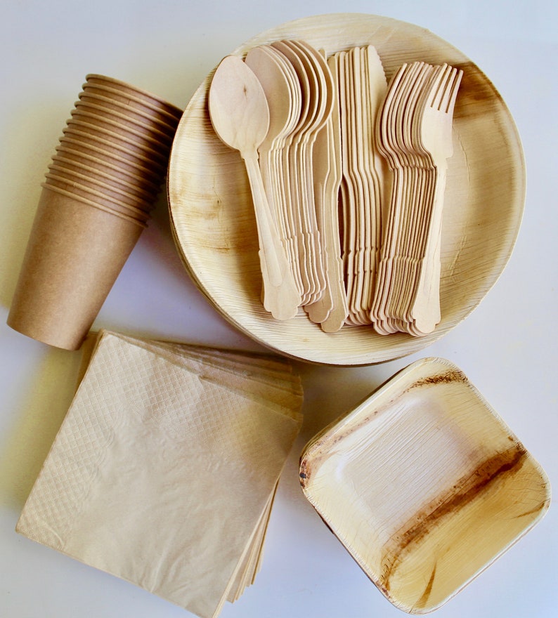 May include: A set of disposable tableware made from palm leaves, including plates, bowls, and cutlery. The set is brown and natural in color and is perfect for eco-friendly dining.