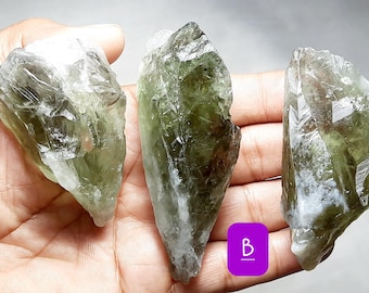May include: Three green and white crystal points, labeled A, B, and C.