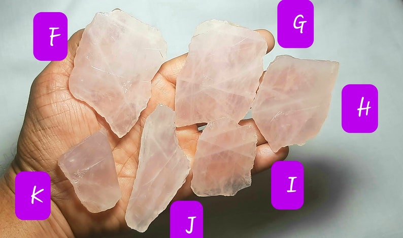 May include: Seven pieces of raw rose quartz crystals in various shapes and sizes. The crystals are a pale pink color and have a translucent appearance.