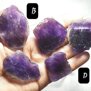 May include: Five amethyst crystal pieces in various shapes and sizes, labelled A through E.