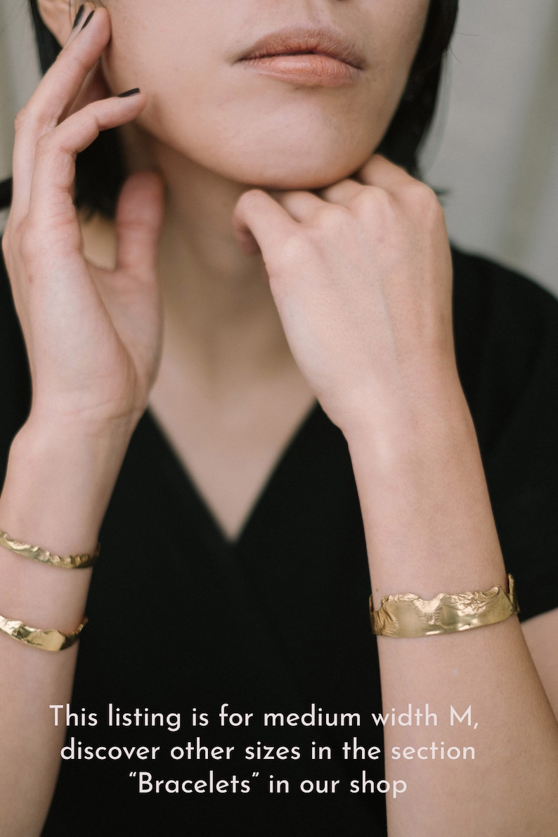 May include: A gold-toned bracelet with a textured, irregular surface. This listing is for the medium width M, discover other sizes in the "Bracelets" section of our shop.