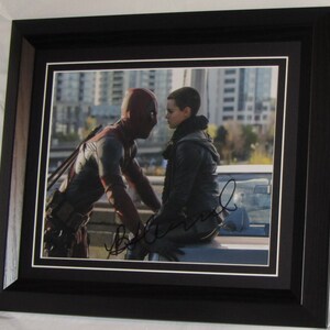 BRIANNA HILDEBRAND signed . Deadpool authentic matted and framed.  Registered Dealer  Not  Copy or Printed