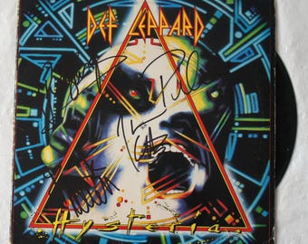 Def Leppard signed Hysteria album cover Signed by 4 Very Rare  Registered Dealer  Photo proof at signing time.