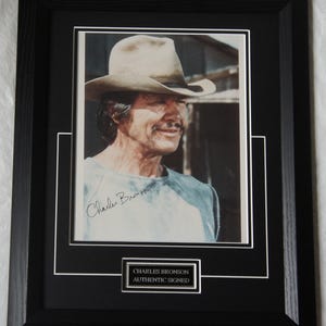 CHARLES BRONSON Signed &quot;Western&quot; actor   Framed authentic 10 x 8  Photo Framed . Registered  Dealer #Not a copy / print