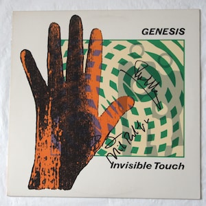 GENESIS Signed Invisible Touch&#39; LP COVER (1986). Signed by : Phil Collins, Mike Rutherford and Tony Banks  Registered Dealer  Includes Disc