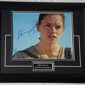 DAISY RIDLEY signed  Actress Star Wars 100 % Authentic. Framed  Registered and approved Dealer  + Signing Details