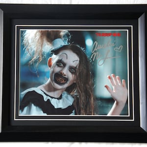AMELIE McLAIN Signed Terrifier 2  Little Pale Girl Matted and framed.  Registered Dealer Not Copy Or Printed signature. #16625