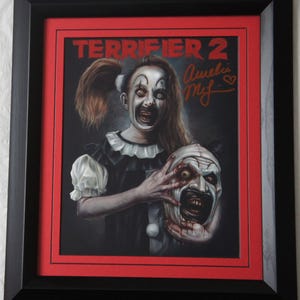 AMELIE McLAIN Signed Terrifier 2  Little Pale Girl Matted and framed.  Registered Dealer Not Copy Or Printed signature. #5825