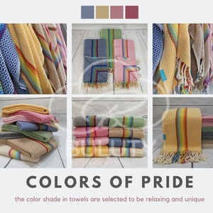 May include: A collection of colorful Turkish towels with rainbow stripes. The towels are made of cotton and are soft and absorbent. They are perfect for the beach, pool, or spa.