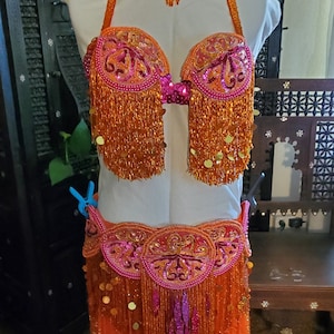 Déguisement professionnel de danse orientale orange et rose fuchsia