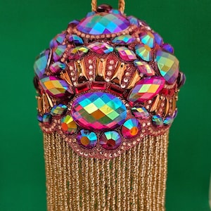 Large iridescent gold-purple-red-green jewels encircle this handmade Christmas ornament with 4&quot; gold beaded fringe (3&quot; ball)