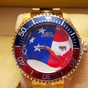 Invicta Pro Diver 27963 47mm Gold-tone Automatic Stainless Steel Watch with Red and Blue Bezel and Red, White and Blue Mother of Pearl Dial