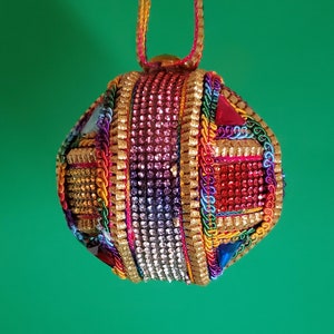 Multicolored rhinestones crisscross this OOAK handmade Christmas ornament (3&quot; ball)