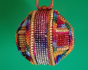 Multicolored rhinestones crisscross this OOAK handmade Christmas ornament (3" ball)