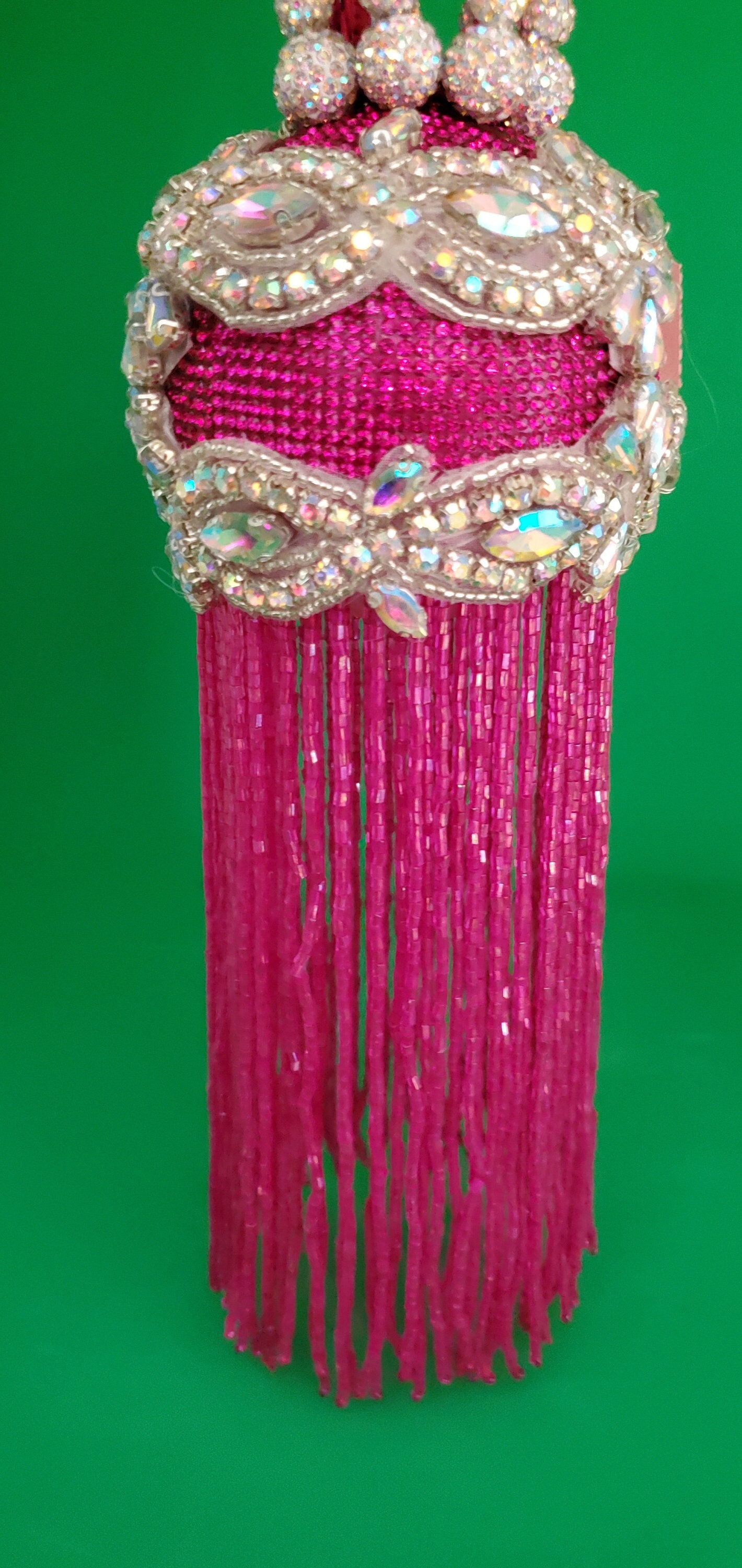 Customizable hot pink and AB rhinestone ornament with 6" hot pink beaded fringe (3" ball).